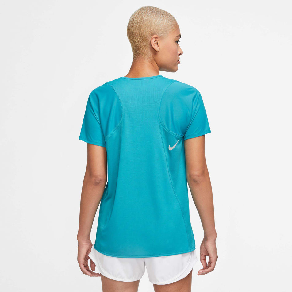 Back view of a model wearing a Nike Women's Dri-FIT Race Short-Sleeve Running Top in the Rapid Teal/Reflective Silv colourway (7980061229218)