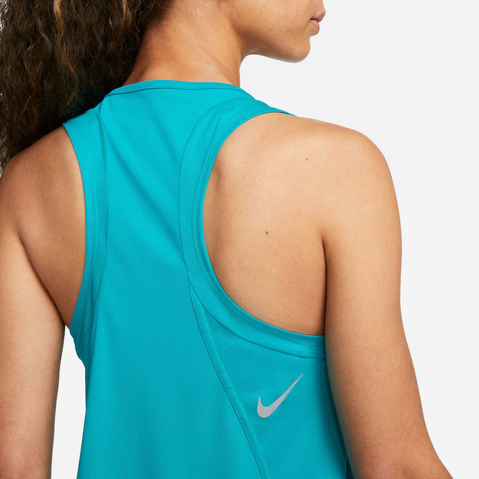 Close-up back view of model wearing a Nike Women's Dri-FIT Race Running Singlet in the Rapid Teal/Reflective Silv colourway (7999728615586)