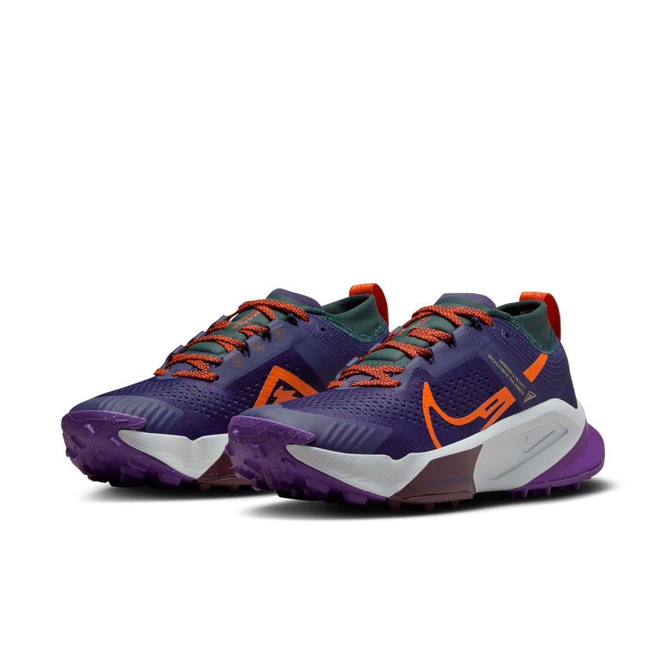 A pair of Nike Women's Zegama Trail Running Shoes in the Purple Ink/Safety Orange-Deep Jungle colourway (8049474764962)
