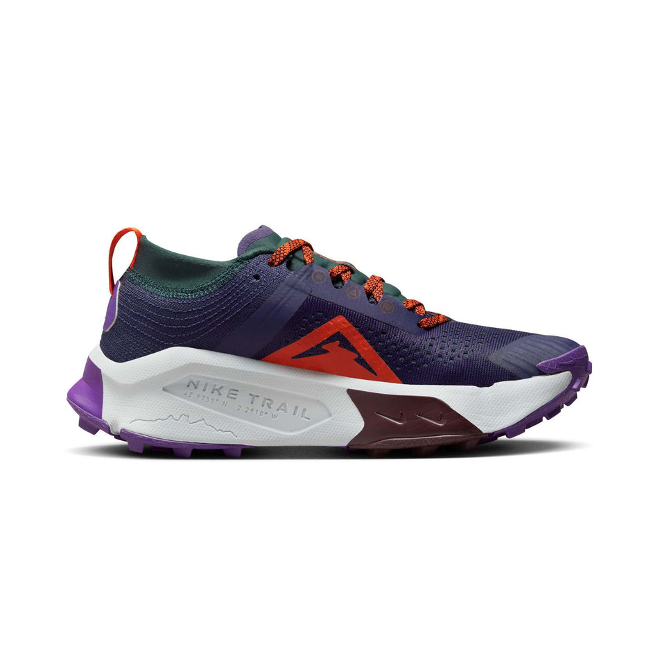 Medial side of the left shoe from a pair of Nike Women's Zegama Trail Running Shoes in the Purple Ink/Safety Orange-Deep Jungle colourway (8049474764962)