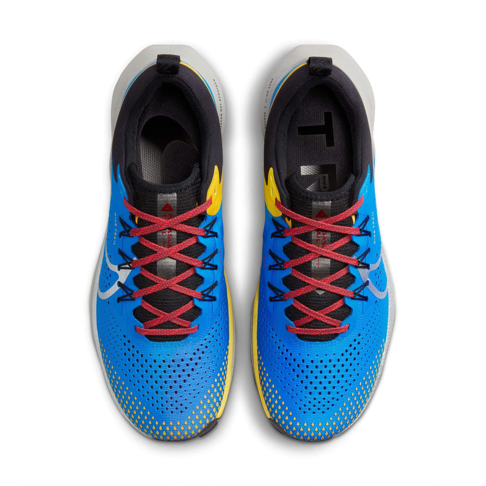 The uppers on a pair of Nike Pegasus Trail 4 Men's Trail Running Shoes in the LT Photo Blue/Metallic Silver-Track Red colourway (7970844377250)