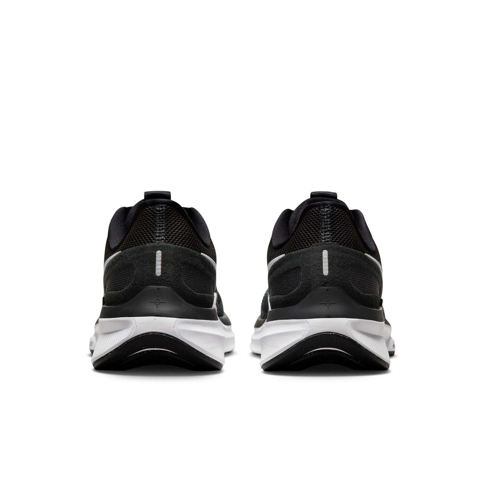The back of a pair of Nike Women's Structure 25 Road Running Shoes in the Black/White-DK Smoke Grey colourway (8025972375714)