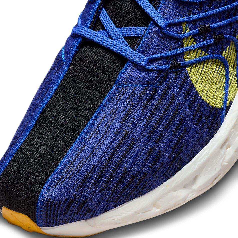 Lateral side of the toe box on the left shoe from a pair of Nike Men's Pegasus Turbo Road Running Shoes in the Racer Blue/High Voltage-Black-Sundial colourway (7970640265378)
