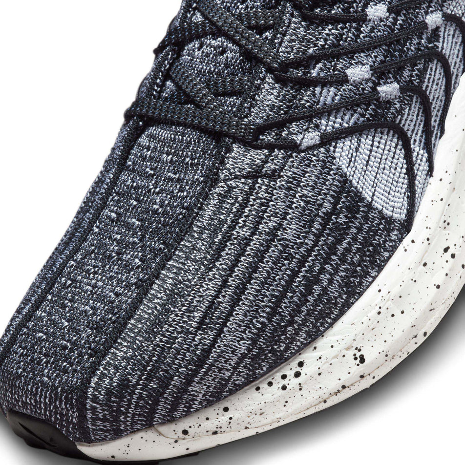 Lateral side of the toe box on the left shoe from a pair of Nike Women's Pegasus Turbo Road Running Shoes in the Black/White colourway (7979317690530)