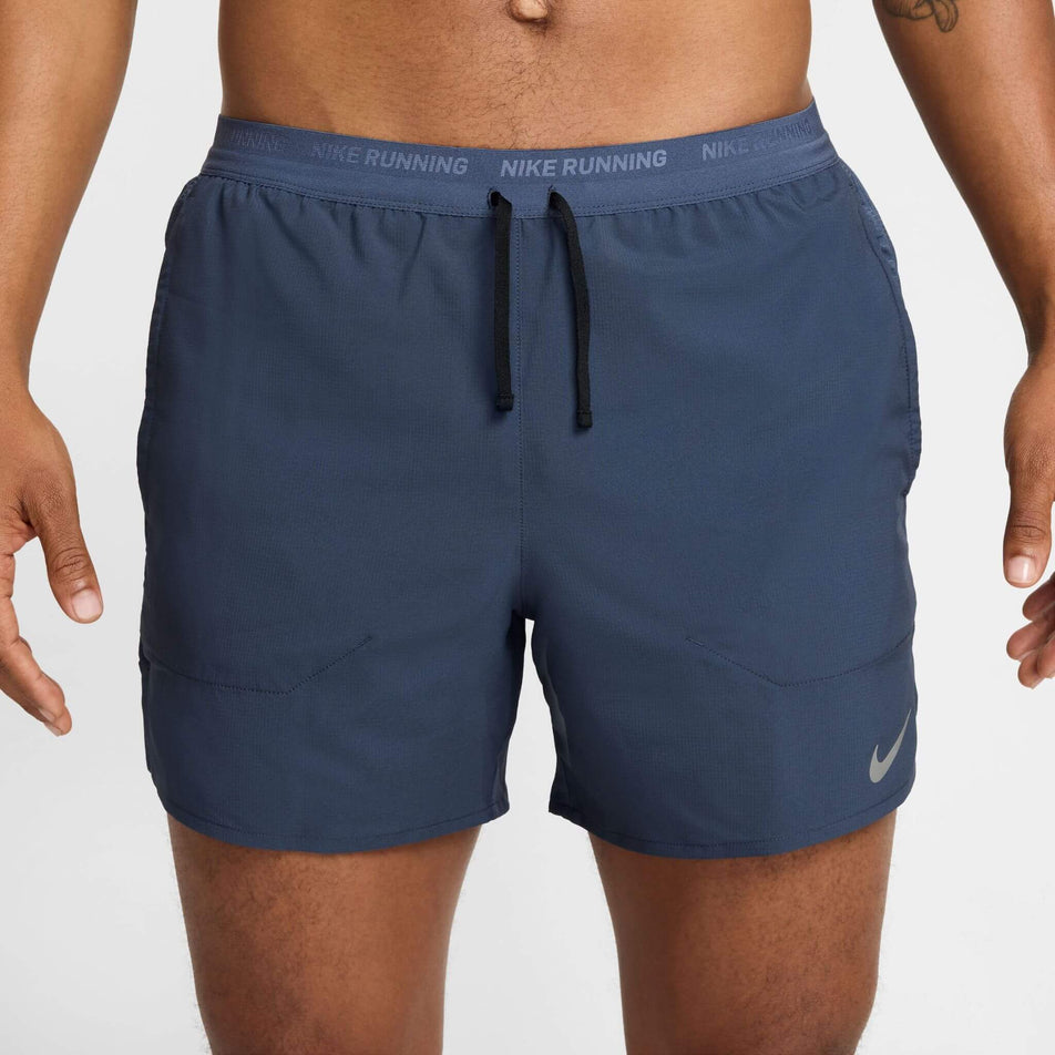 Front view of a model wearing the Nike Men's Dri-FIT Stride 5