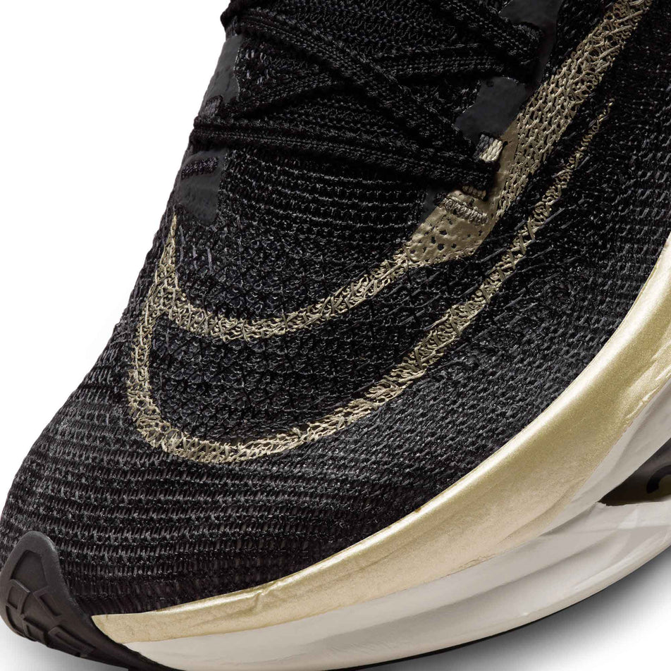 Close up of toe box on left shoe from a pair of Men's Alphafly 2 Road Racing Shoes in the Black/Mtlc Gold Grain-Sail colourway (8064213418146)