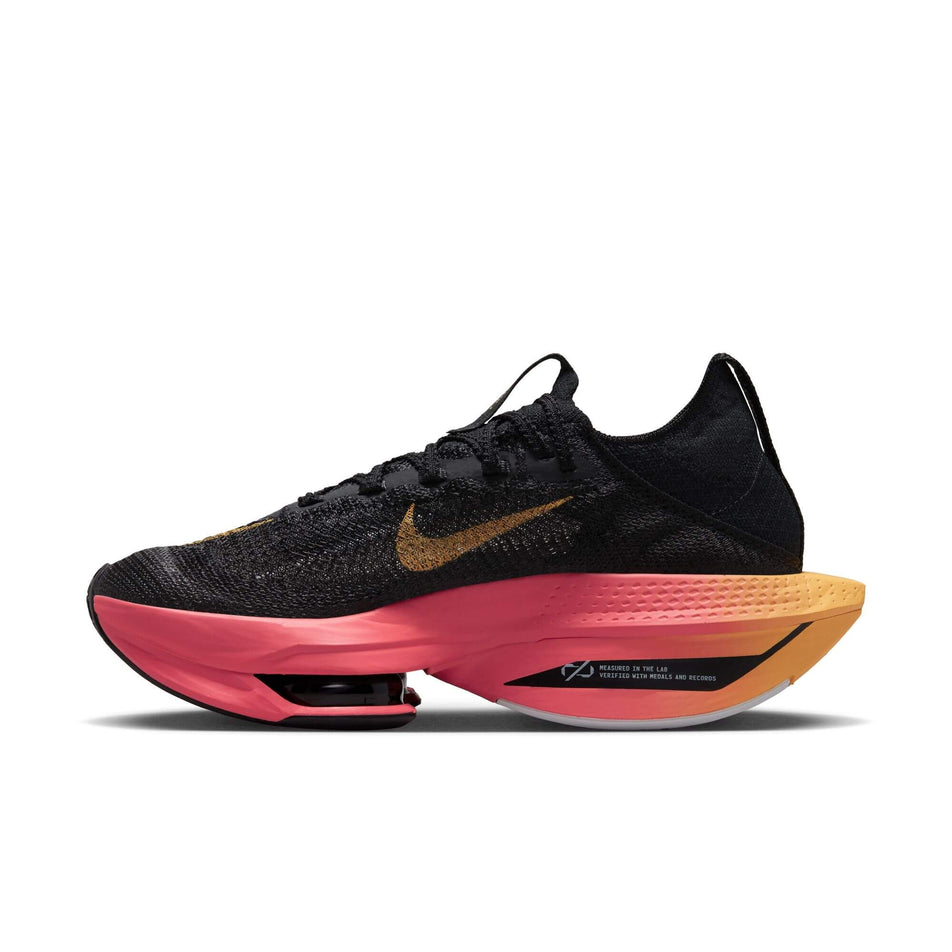Medial side of the right shoe from a pair of Nike Women's Alphafly 2 Road Racing Shoes in the BLACK/TOPAZ GOLD-SEA CORAL-WHITE colourway (7870344462498)