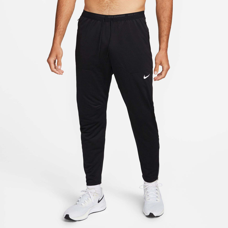 Front view of a model wearing a pair of Nike Men's Phenom Dri-FIT Knit Running Pants in the Black/Reflective SIlv colourway (8049583325346)