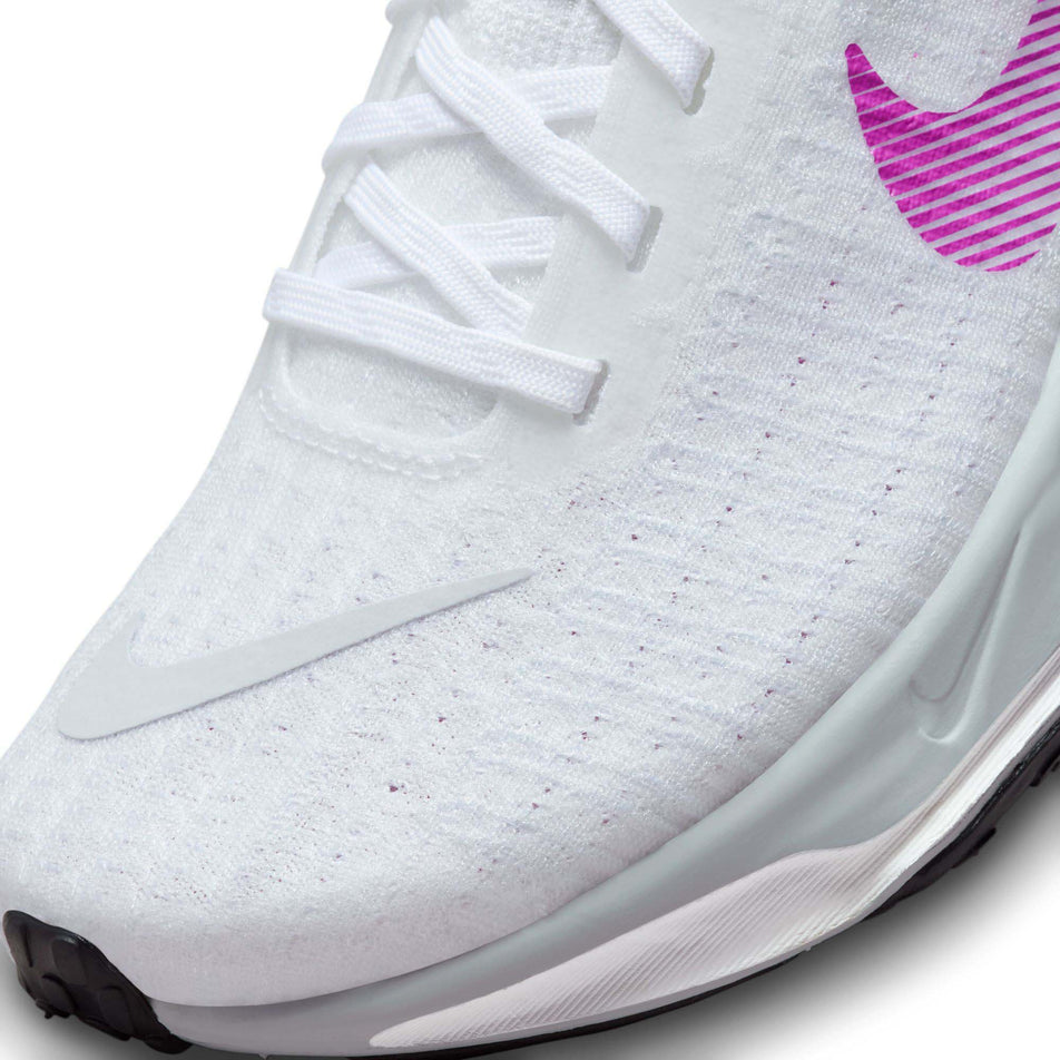 Lateral side of the toe box on the left shoe from a pair of Nike Women's Invincible 3 Road Running Shoes in the White/Vivid Purple-Vivid Sulfur colourway (7979350261922)