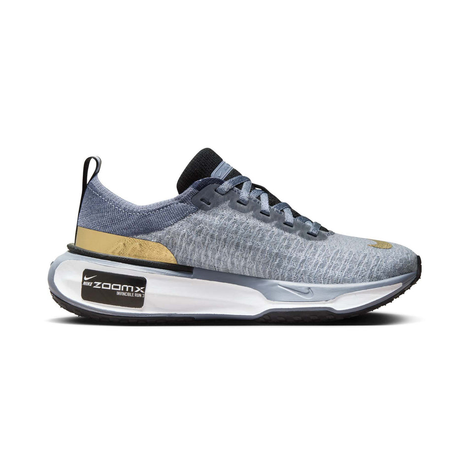 Medial side of the left shoe from a pair of Nike  Women's Invincible 3 Road Running Shoes in the Ashen Slate/Metallic Gold-Diffused Blue colourway (8070590333090)