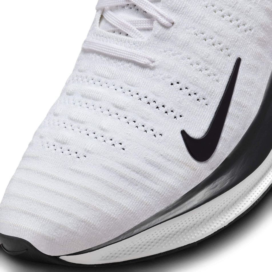 Lateral side of the toe box on the right shoe from a pair of Nike Men's Infinity RN 4 Road Running Shoes in the White/Velvet Brown-Platinum Tint colourway (7979509055650)