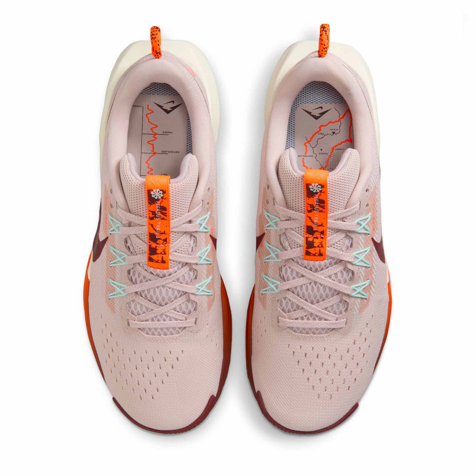 The uppers of a pair of Nike Women's Pegasus Trail 5 Running Shoes in the Silt Red/Dark Team Red-Hyper Crimson colourway. (8686796079266)