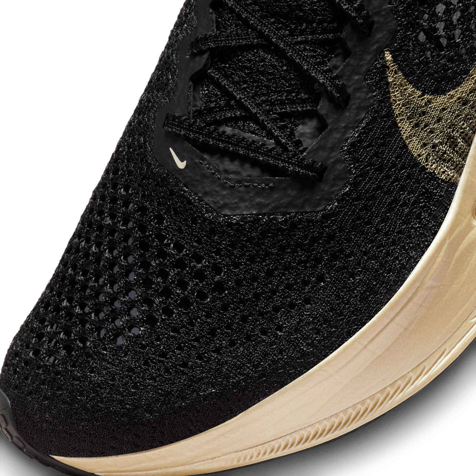 Lateral side of the toe box on the left shoe from a pair of Nike Men's Vaporfly 3 Road Racing Shoes in the Black/Mtlc Gold Grain-Black-Oatmeal colourway (8048741220514)