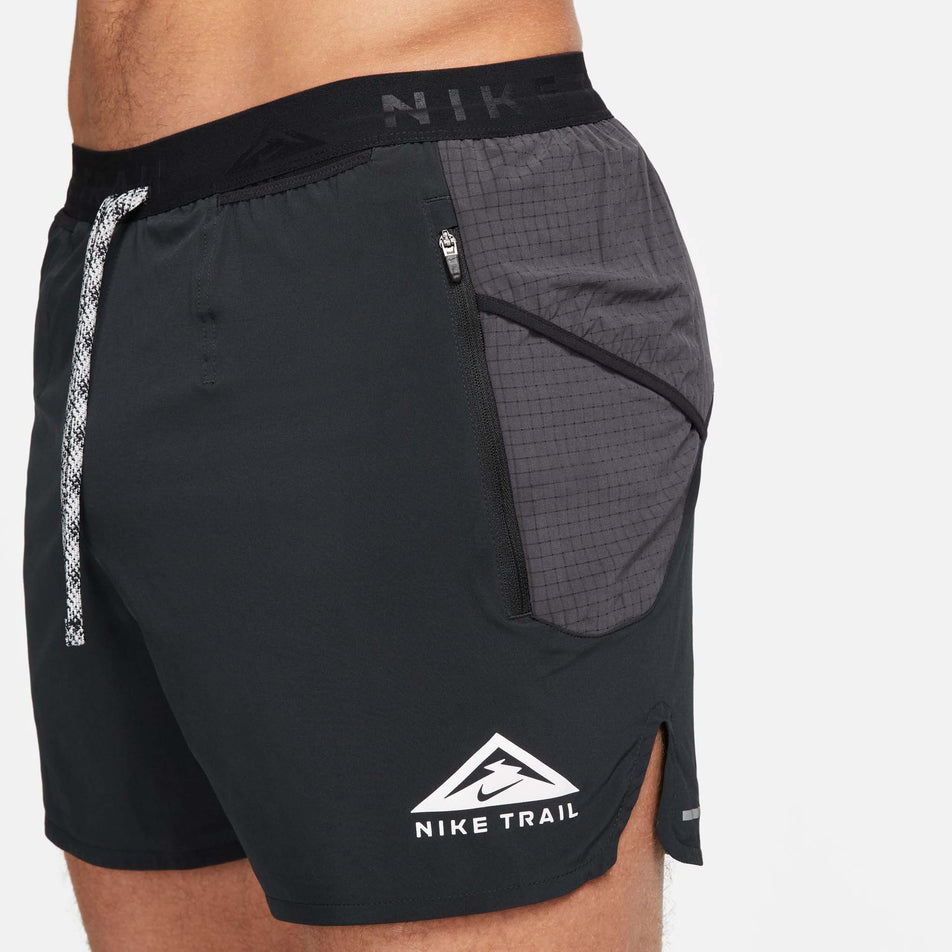 Angled front view of the left side of a pair of Nike Men's Dri-FIT Trail Second Sunrise 5