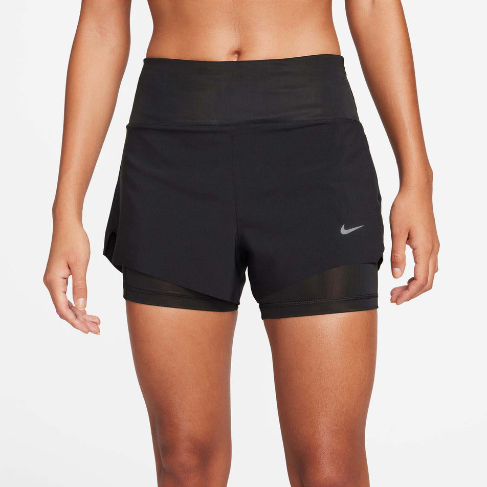Front view of a model wearing a pair of Nike Women's Dri-FIT Swift Mid-Rise 3