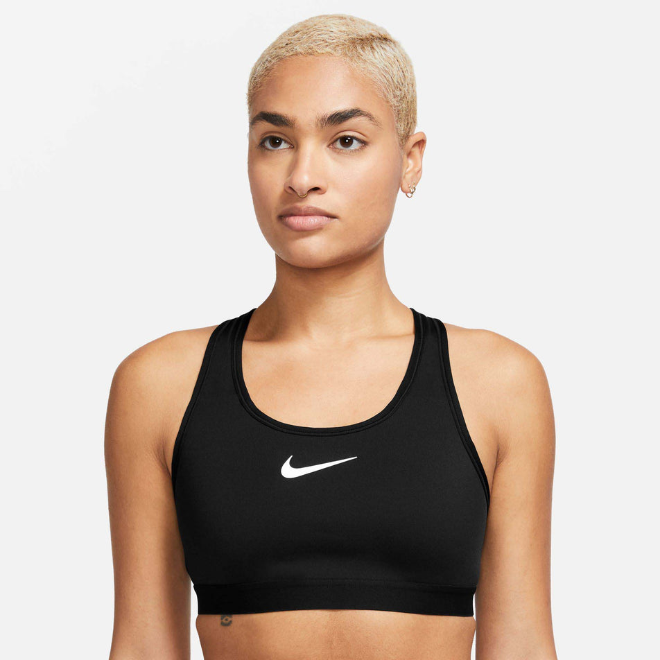 Front view of a model wearing a Nike Women's Swoosh High Support Non-Padded Adjustable Bra in the Black/Iron Grey/White colourway  (7980204916898)