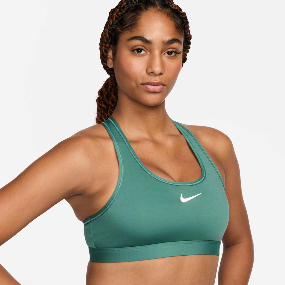 Front view of a model wearing a Nike Women's Swoosh Medium Support Padded Sports Bra in the Bicoastal/White colourway.  (8299354063010)