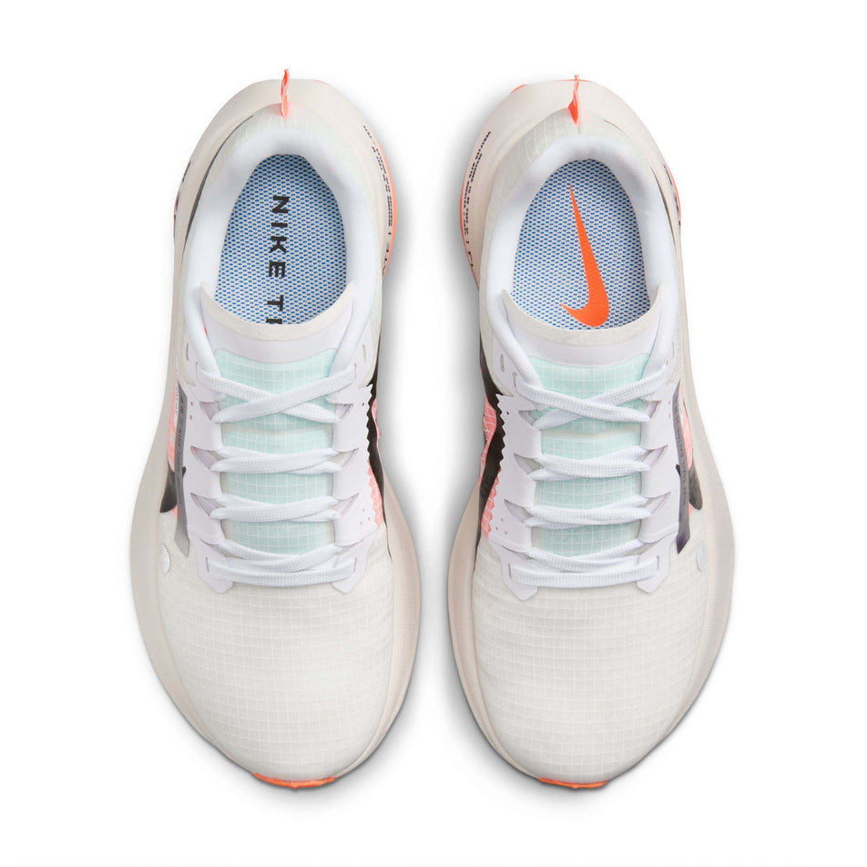 The uppers on a pair of Nike Women's Ultrafly Trail Running Shoes in the White/Black-Total Orange-Pale Ivory colourway  (7995936637090)