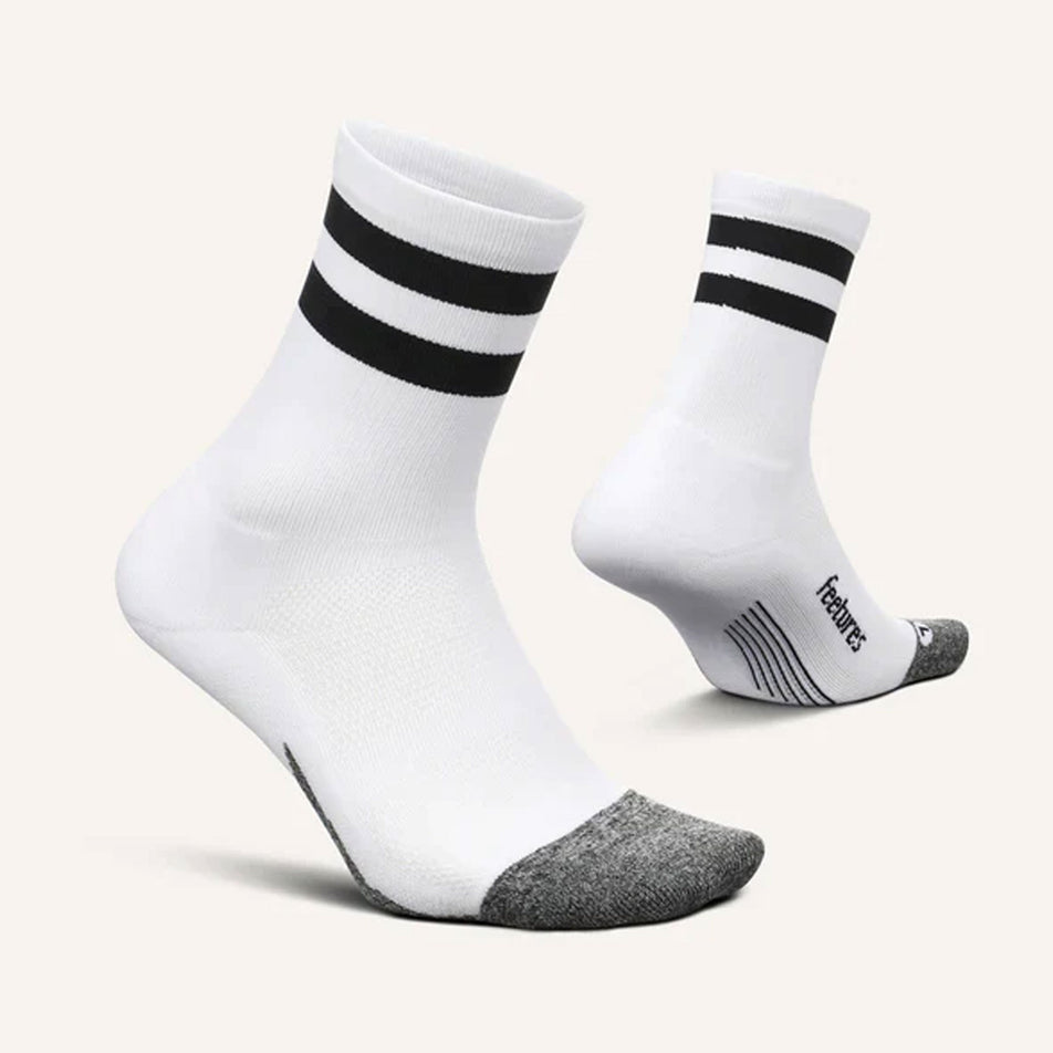 A pair of Feetures Unisex Elite Light Cushion Mini Crew running socks in the White High Top Stripe colourway (7520309051554)