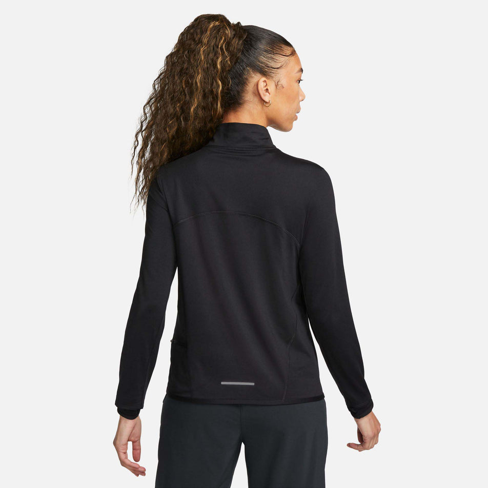 Back view of a model wearing a Nike Women's Dri-FIT Swift Element UV 1/4-Zip Running Top in the Black/Reflective Silv colourway (8049594007714)