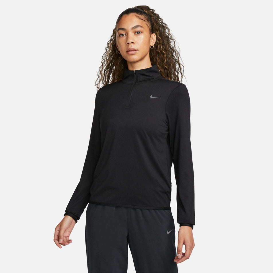 Front view of a model wearing a Nike Women's Dri-FIT Swift Element UV 1/4-Zip Running Top in the Black/Reflective Silv colourway (8049594007714)