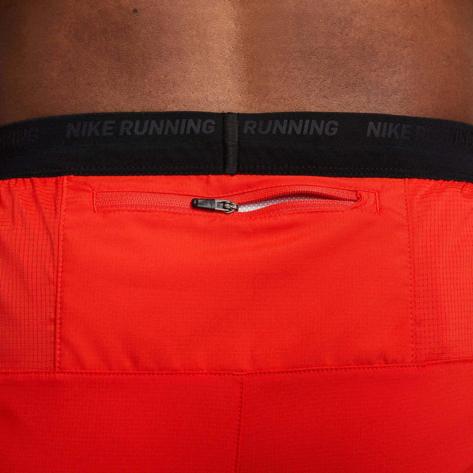 Close-up view of the zipped back pocket on a pair of Nike Men's Dri-FIT Stride Kipchoge 7