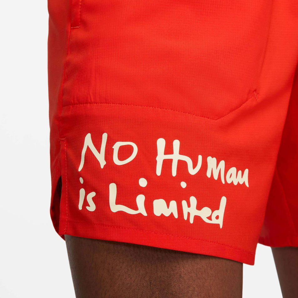 Close-up view of the 'No Human is Limited' call-out on the front of the right-leg of a pair of Nike Men's Dri-FIT Stride Kipchoge 7