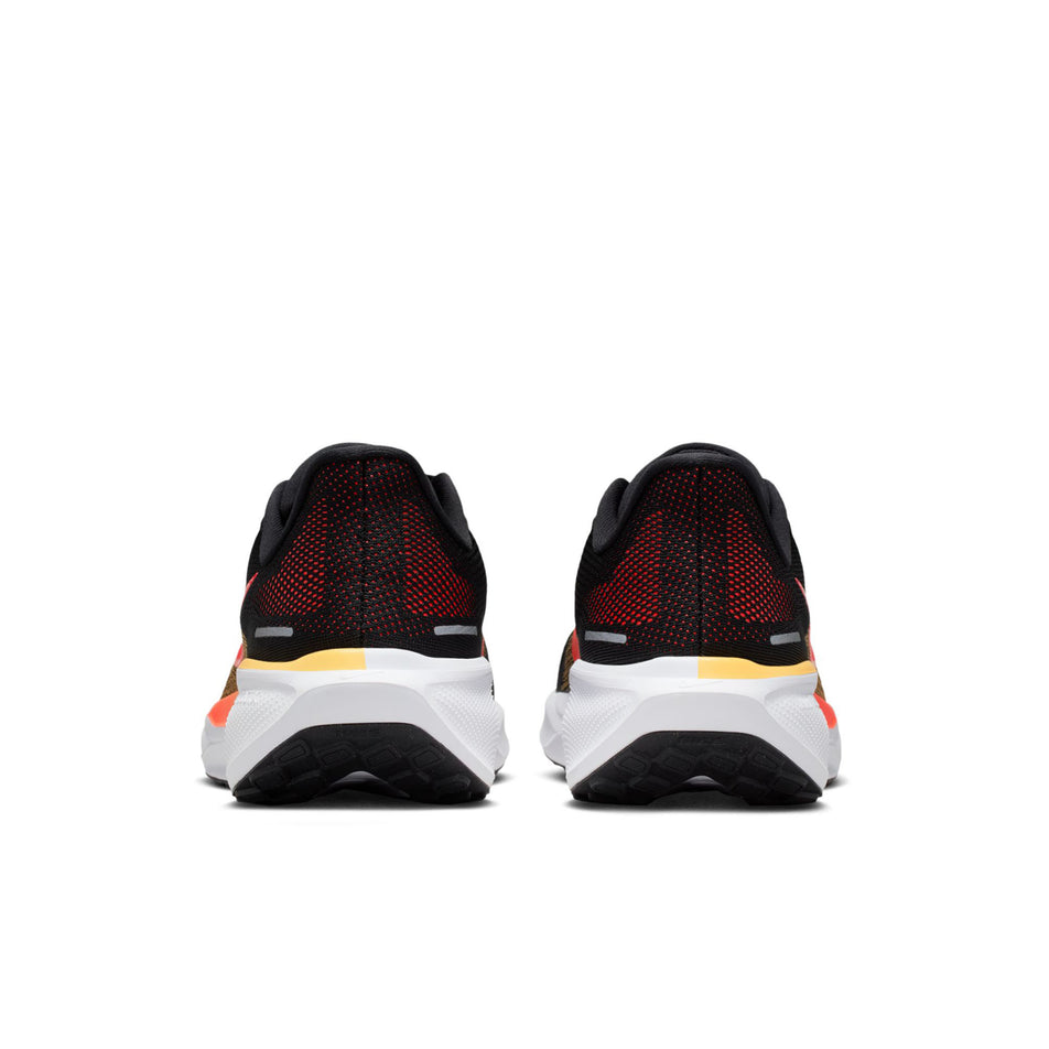 The back of a pair of Nike Men's Pegasus 41 Road Running Shoes in the Black/Bright Crimson-Topaz Gold colourway.