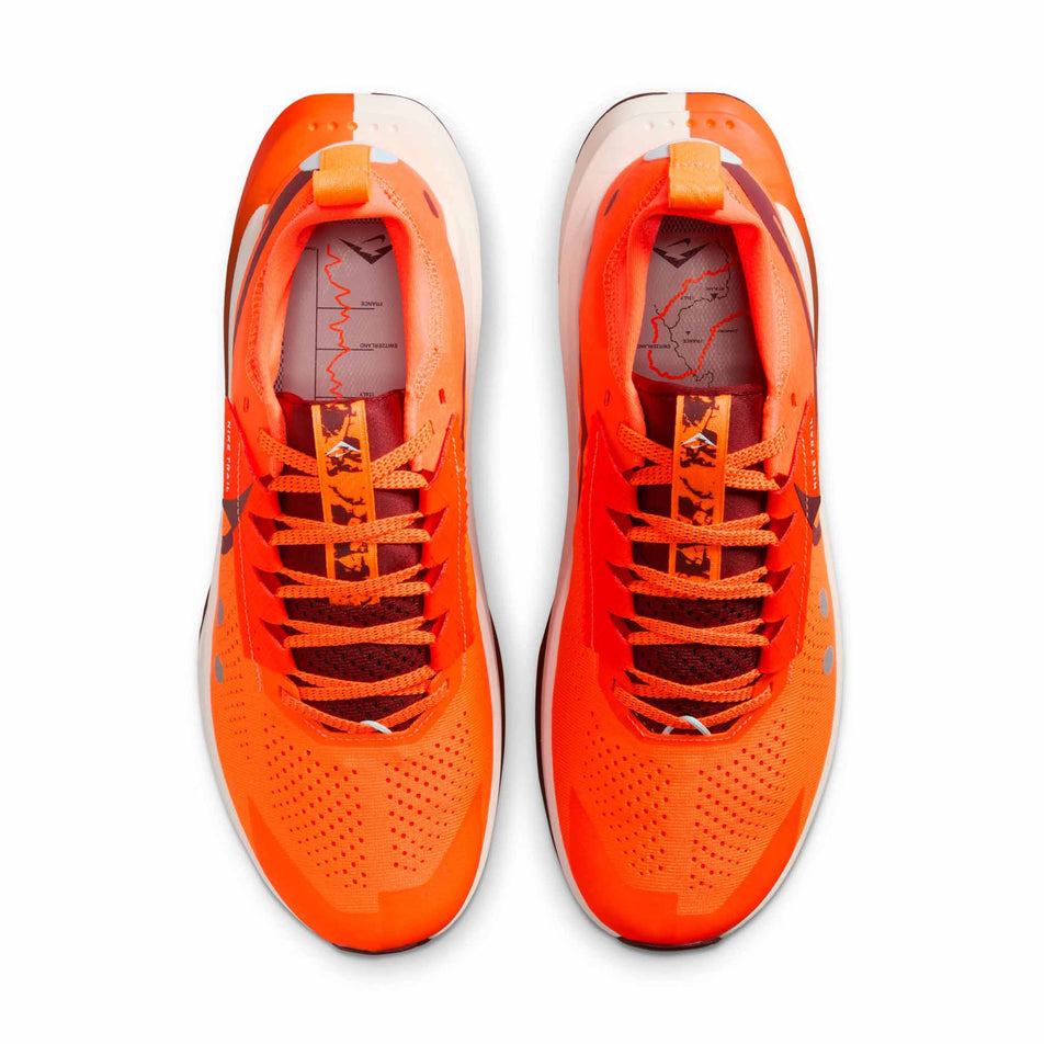 The upper of a pair of Nike Men's Zegama Trail 2 Running Shoes in the Hyper Crimson/Dark Team Red-Glacier Blue colourway. (8724585021602)