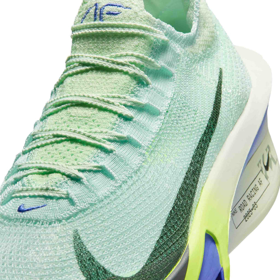 Close-up view of the upper of the left shoe from a pair of Nike Men's Alphafly 3 Road Racing Shoes in the Barely Green/Black Spruce-Volt Ting colourway.