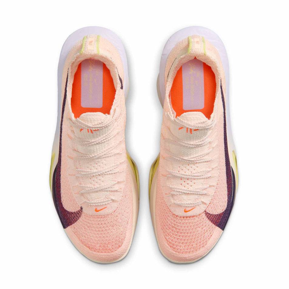 The uppers of a pair of Nike Women's Alphafly 3 Road Racing Shoes in the Chalk/Purple Dynasty-Hyper Crimson colourway.
