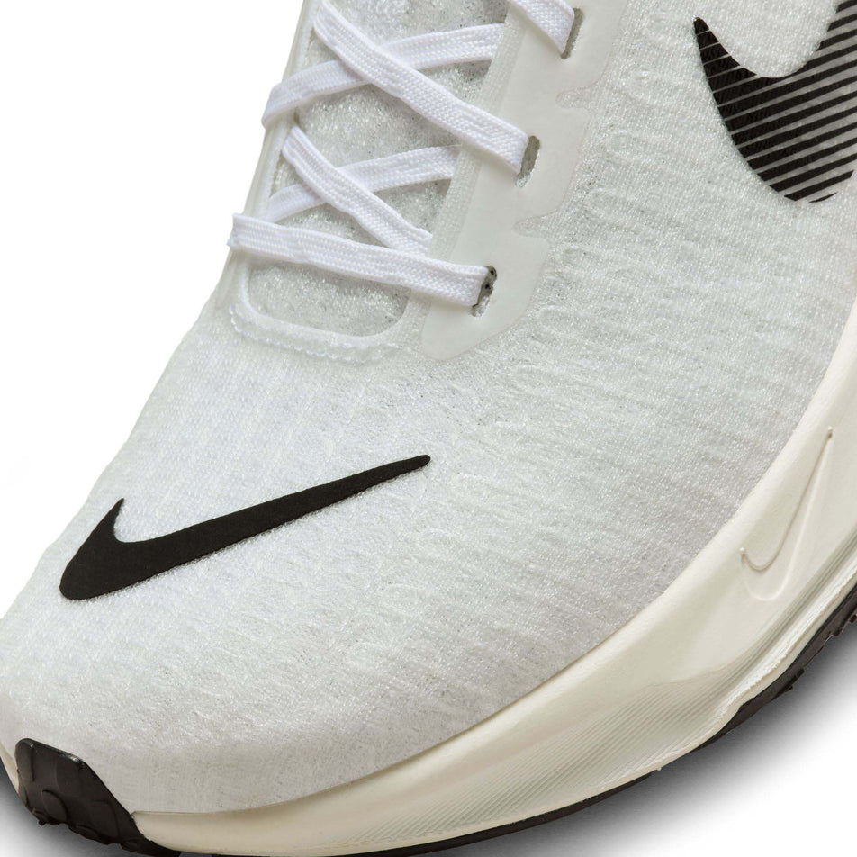 Lateral side of the toe box on the left shoe from a pair of Nike Men's Invincible 3 SE Road Running Shoes in the White/Black-Lime Blast-Blue Lightning colourway  (7995539128482)