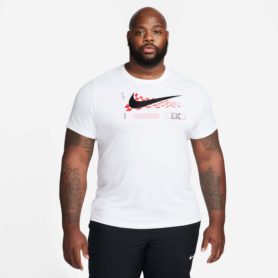 Front view of a model wearing a Nike Men's Eliud Kipchoge Dri-FIT Running T-Shirt in the White colourway (8029388964002)