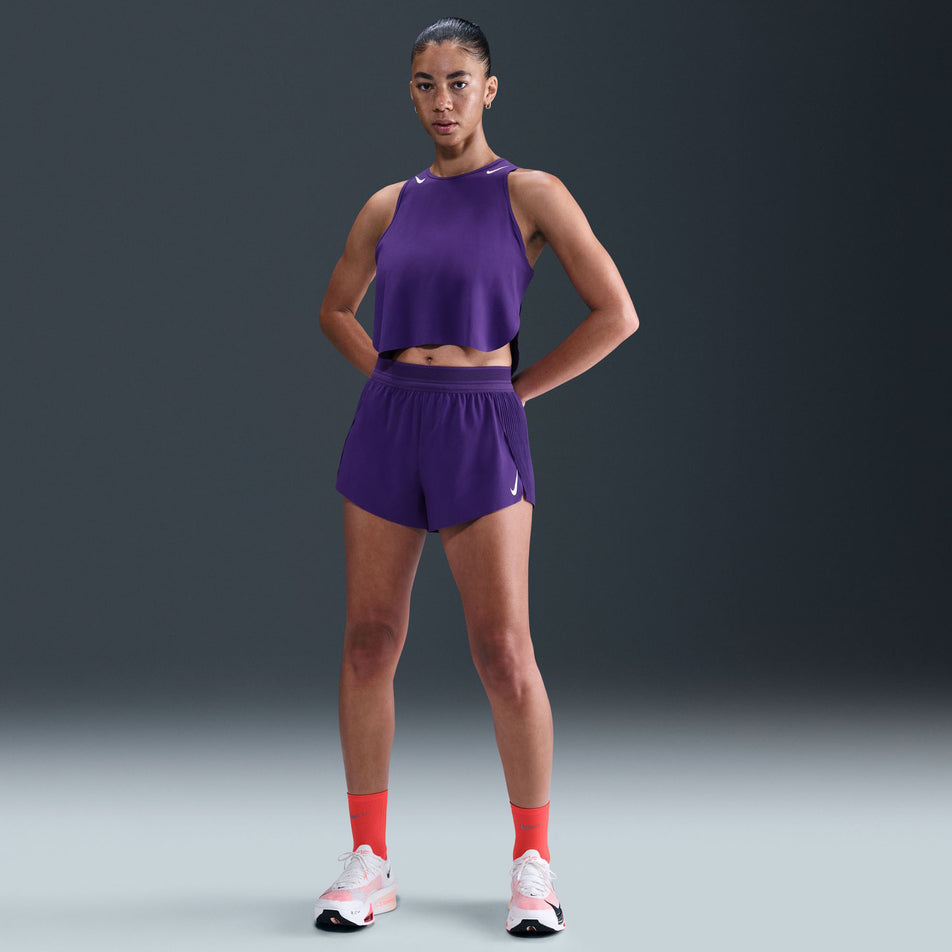 Front view of a model wearing the Nike Women's AeroSwift Dri-FIT ADV Mid-Rise Brief-Lined 3
