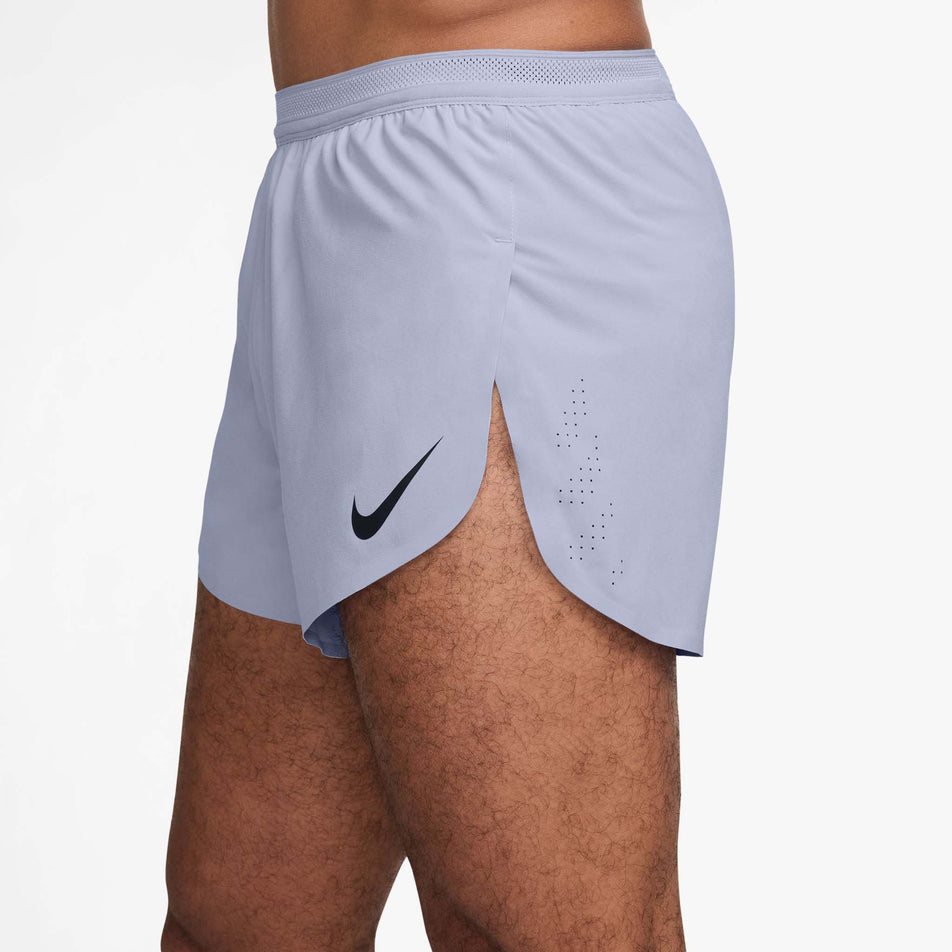 Side view of a model wearing the Nike Men's AeroSwift Dri-FIT ADV 4