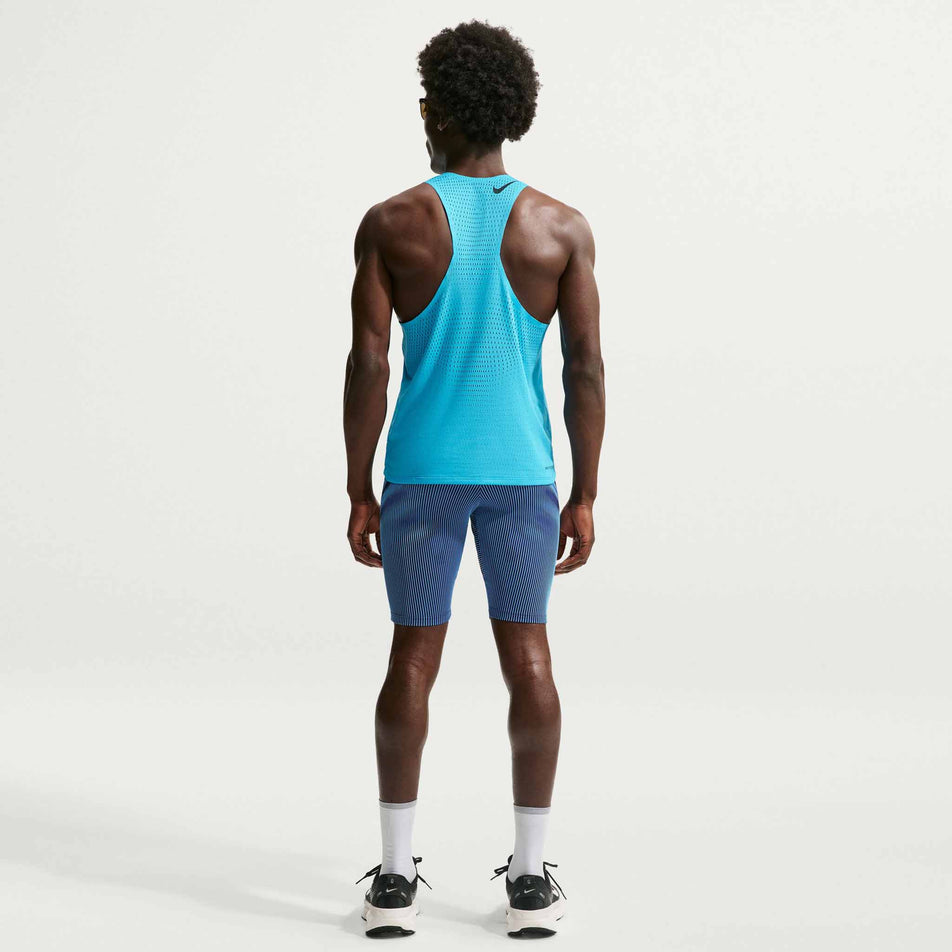 Back view of a model wearing the Nike Men's AeroSwift Dri-FIT ADV Running 1/2-Length Tights in the Baltic Blue/Black/Old Royal Black colourway.