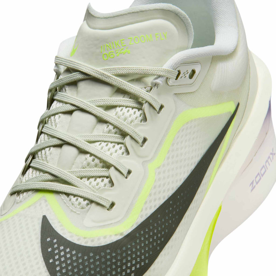 Close-up view of the upper of the left shoe from a pair of Nike Men's Zoom Fly 6 Running Shoes in the Sea Glass/Sequoia-Ultralime-Phantom colourway.