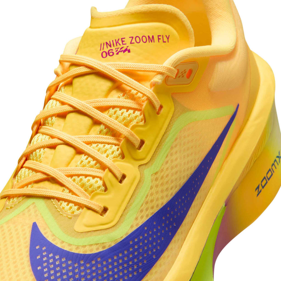 Close-up view of the upper of the left shoe from a pair of Nike Men's Zoom Fly 6 Road Running Shoes in the Citron Pulse/Indigo Burst-Volt Ice colourway.