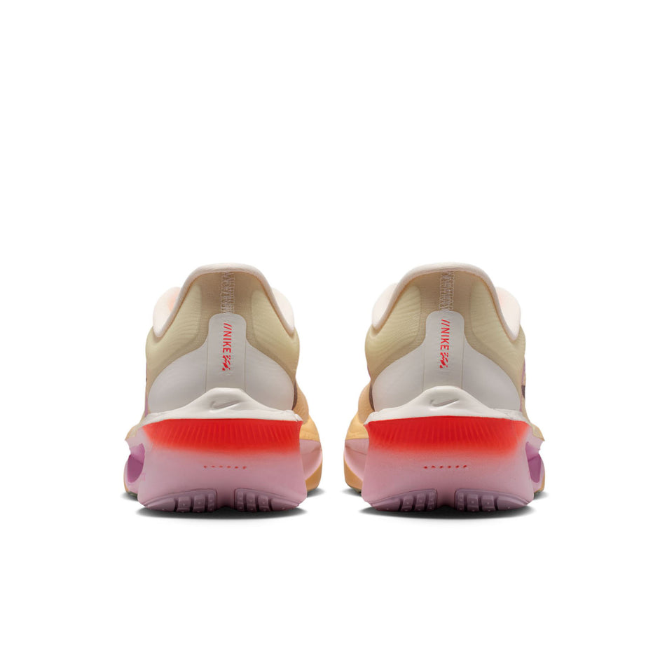 The back of a pair of Nike Women's Zoom Fly 6 Road Running Shoes in the Sail/Tattoo-Light Magenta-Pearl Pink colourway.
