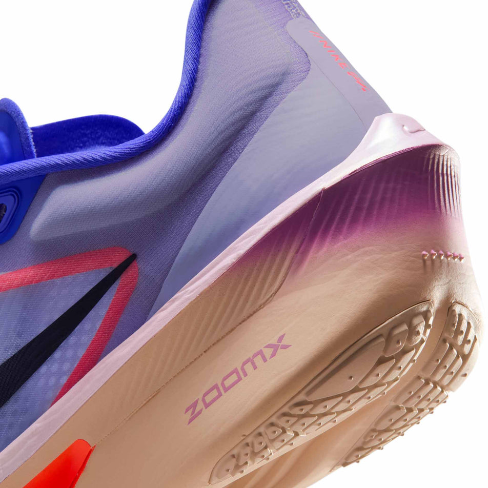 Close-up view of the rearfoot section of the left shoe from a pair of Nike Women's Zoom Fly 6 Road Running Shoes in the Violet Mist/Purple Dynasty-Hot Lava colourway.