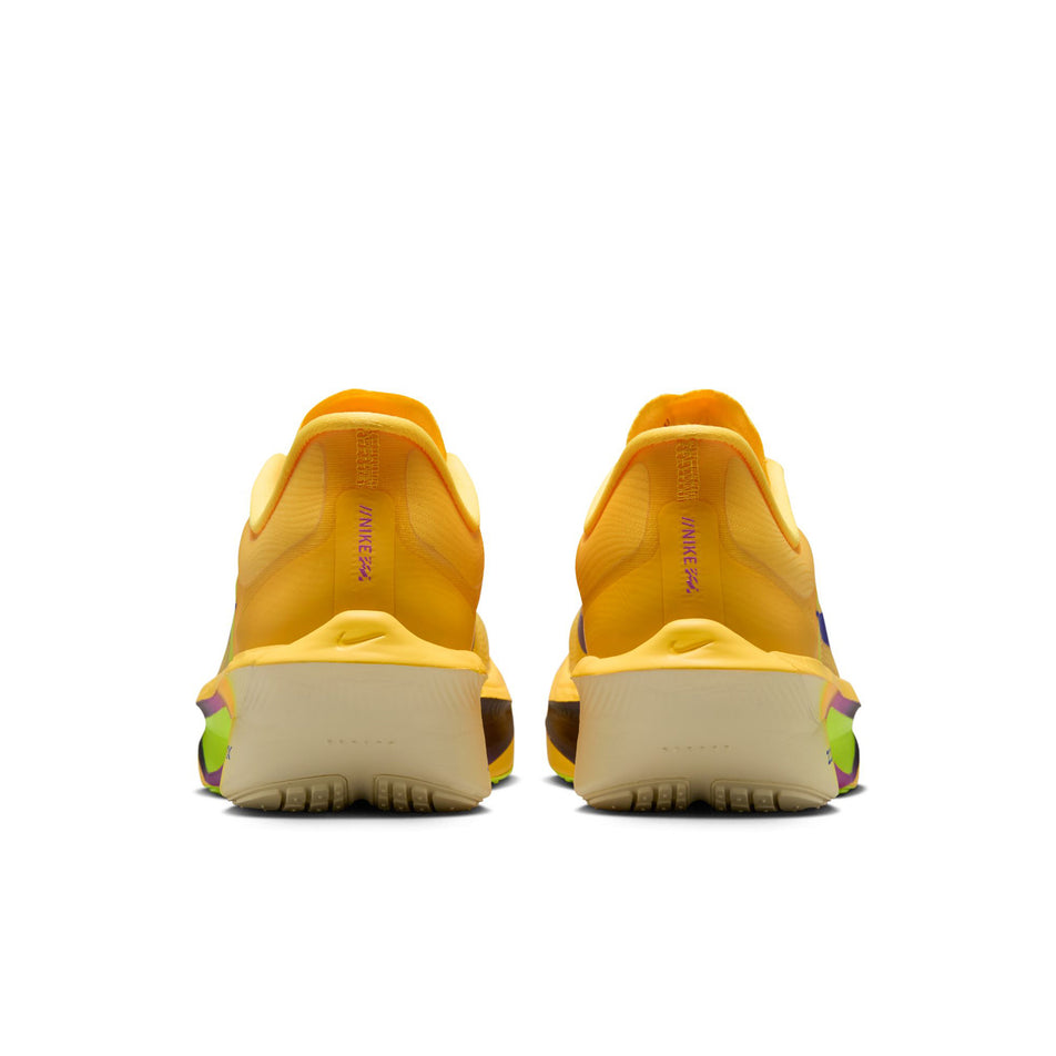 The back of a pair of Nike Women's Zoom Fly 6 Road Running Shoes in the Citron Pulse/Indigo Burst-Volt Ice colourway.