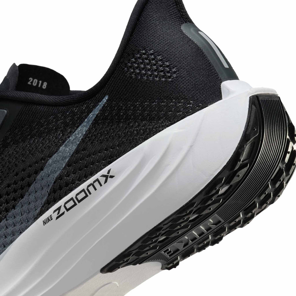 Close up of the midsole of the left shoe from a pair of Nike Men's Pegasus Plus Road Running Shoes in the Black/Pure Platinum-Anthracite-White colourway. (8683698192546)