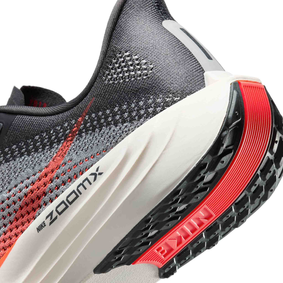 Close up of the midsole of the left shoe from a pair of Nike Men's Pegasus Plus Road Running Shoes in the Anthracite/Bright Crimson-Light Smoke Grey colourway. (8683710185634)