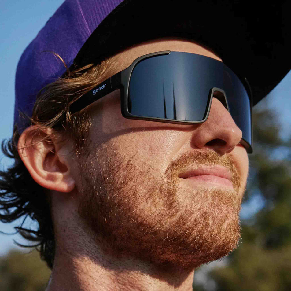 Side view of a model wearing a pair of goodr My Sweat Has An Octane Rating - Astro G - Sunglasses