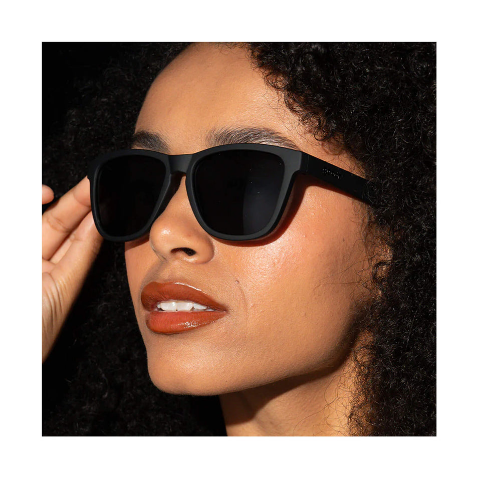 A pair of goodr OG Running Sunglasses in the A Unicorn's Calamity style. Glasses are being worn by a model. 