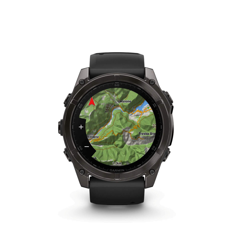 A Garmin fēnix 8 in the 51mm case size. Carbon grey DLC with Black/pebble grey silicone band. Topo map screen.