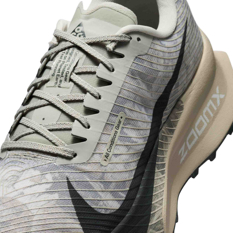 Close-up view of the upper of the left shoe from a pair of Nike Unisex ACG Ultrafly Trail Racing Shoes in the Spruce Fog/Black Spruce-Sea Glass colourway.