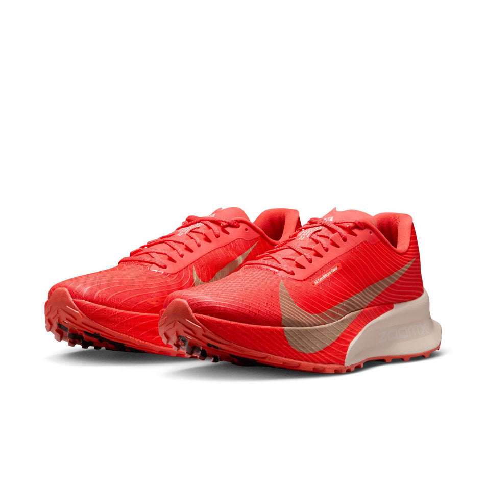 A pair of Nike Unisex ACG Ultrafly Trail Racing Shoes in the Light Crimson/Pure Platinum-Summit White colourway.