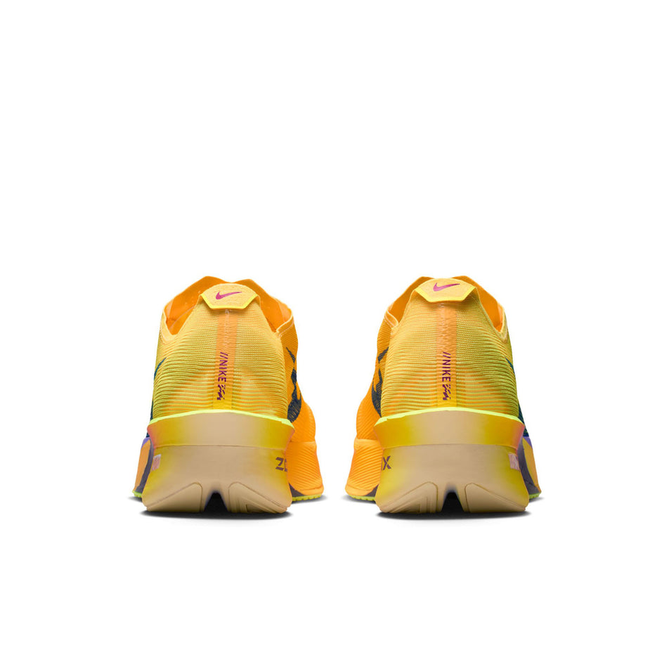 The back of a pair of Nike Men's Vaporfly 4 Road Racing Shoes in the Citron Pulse/Indigo Burst-Laser Orange colourway.
