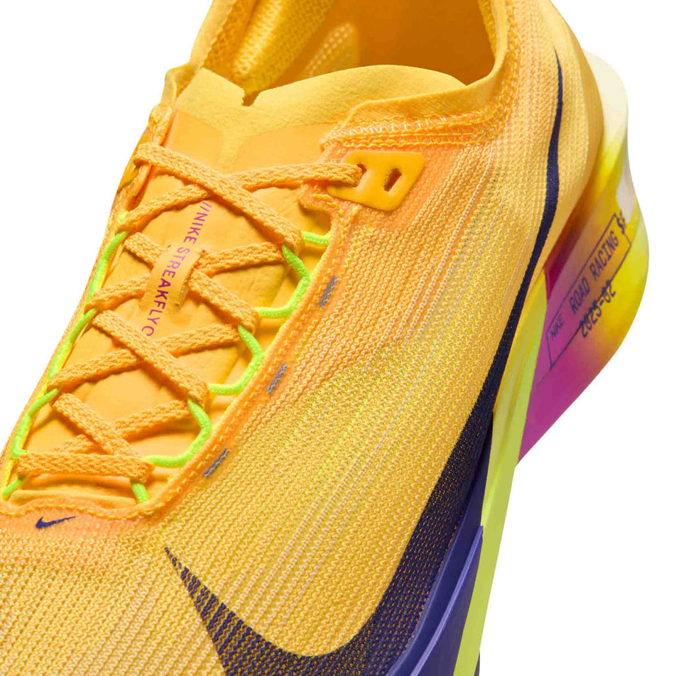 Close-up view of the upper of the left shoe from a pair of Nike Men's Streakfly 2 Road Racing Shoes in the Citron Pulse/Indigo Burst-Volt Ice colourway.